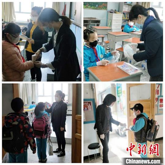 乌鲁木齐市第一小学开学第一天,老师们为学生测温。 李金艳 摄 乌鲁木齐市第一小学开学第一天,老师们为学生测温。 李金艳 摄